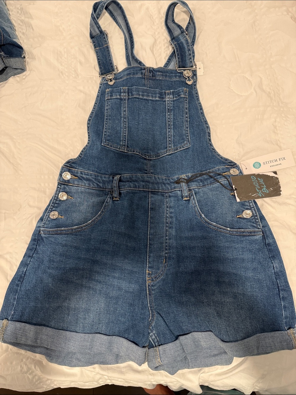 Studio Blue denim tag on medium blue jean